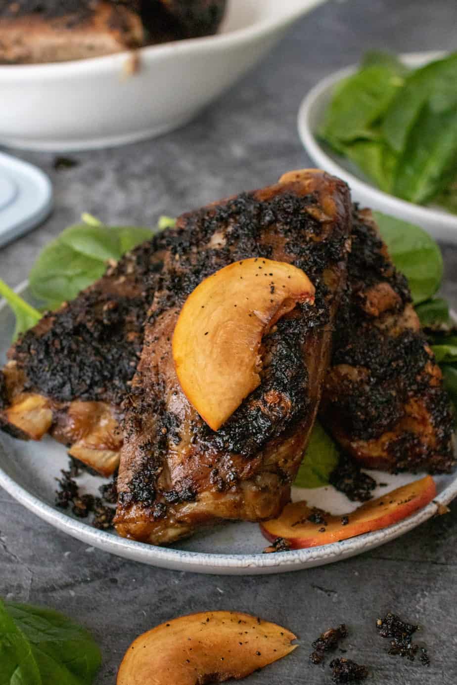whole30 coffee rubbed ribs garnished with a peach sliver 