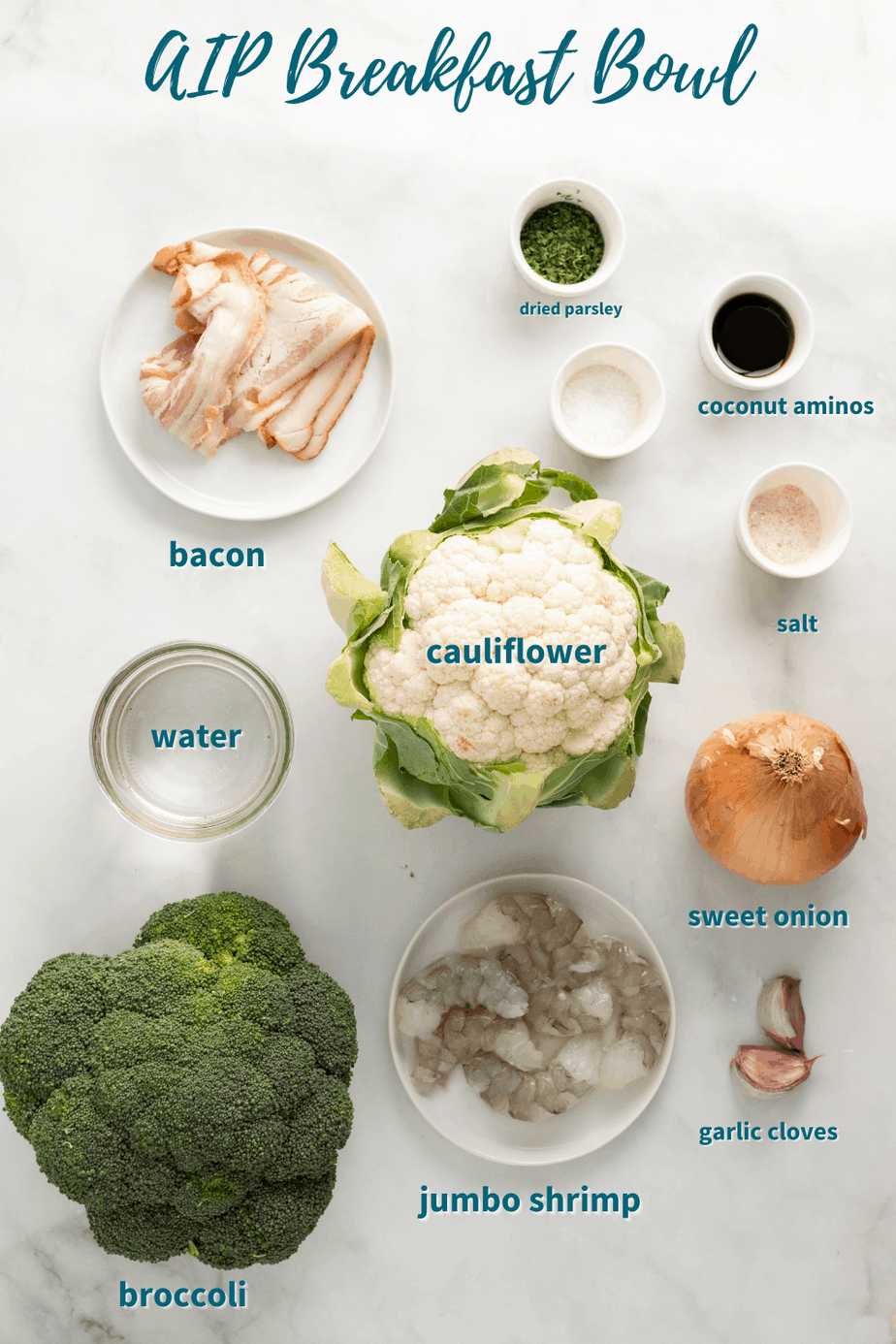 aip breakfast bowl ingredients spread out on counter top; bacon, dried parsley, coconut aminos, salt, water, cauliflower, sweet onion, jumbo shrimp, broccoli, garlic cloves