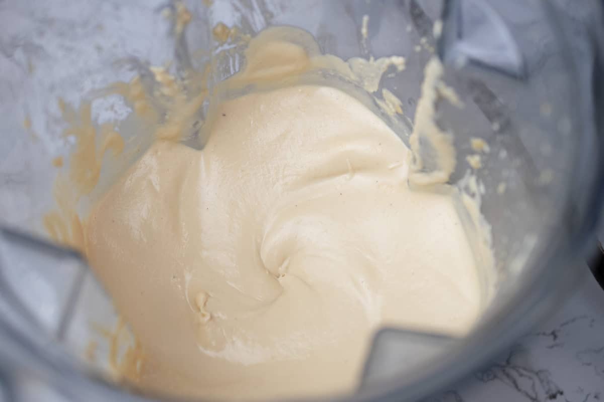 creamy vegan cream cheese frosting in a blender