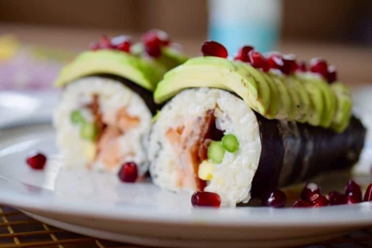 closeup of paleo sushi with avocado and pomegranate