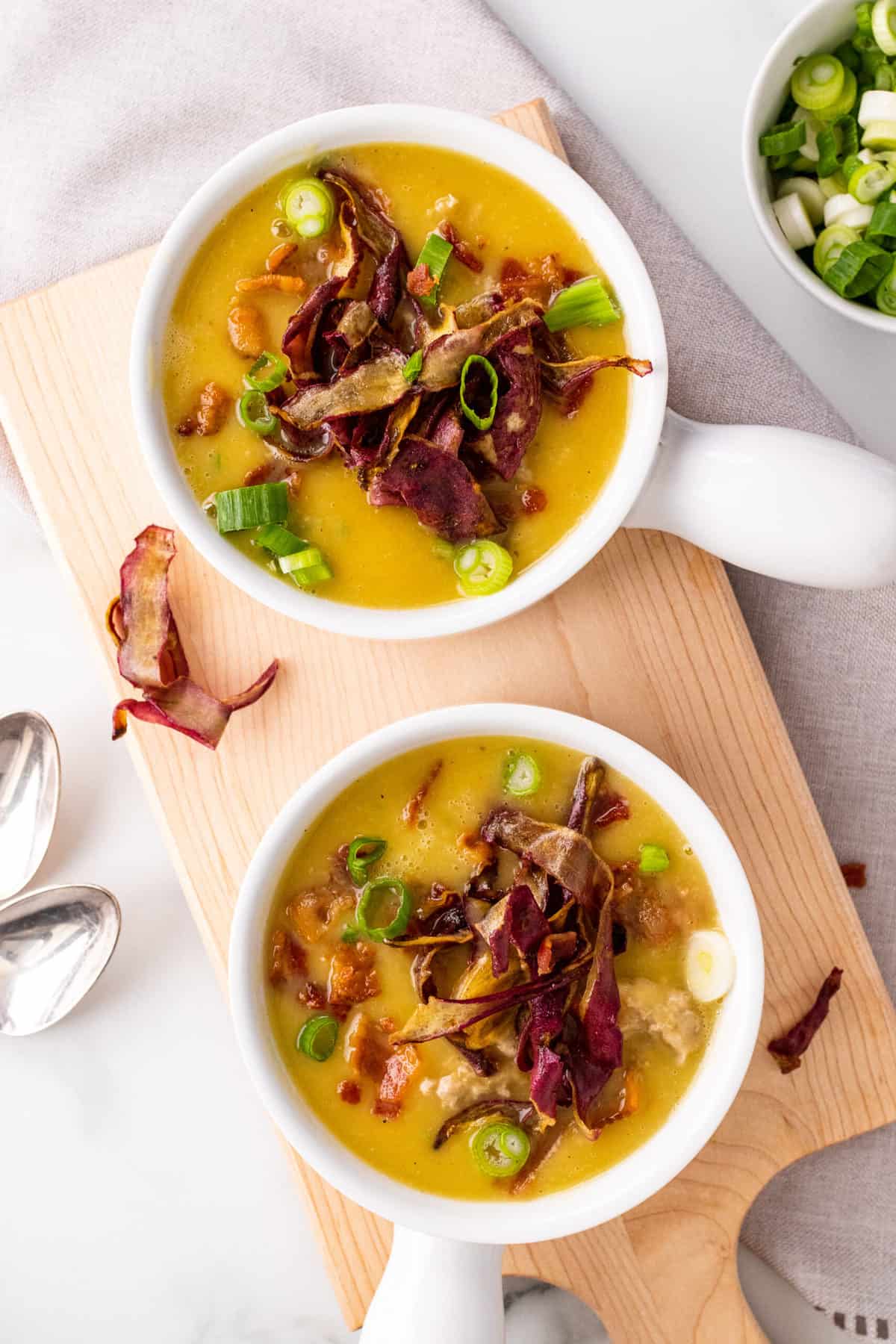 two while bowls on a cutting board with sweet potato turkey chili 