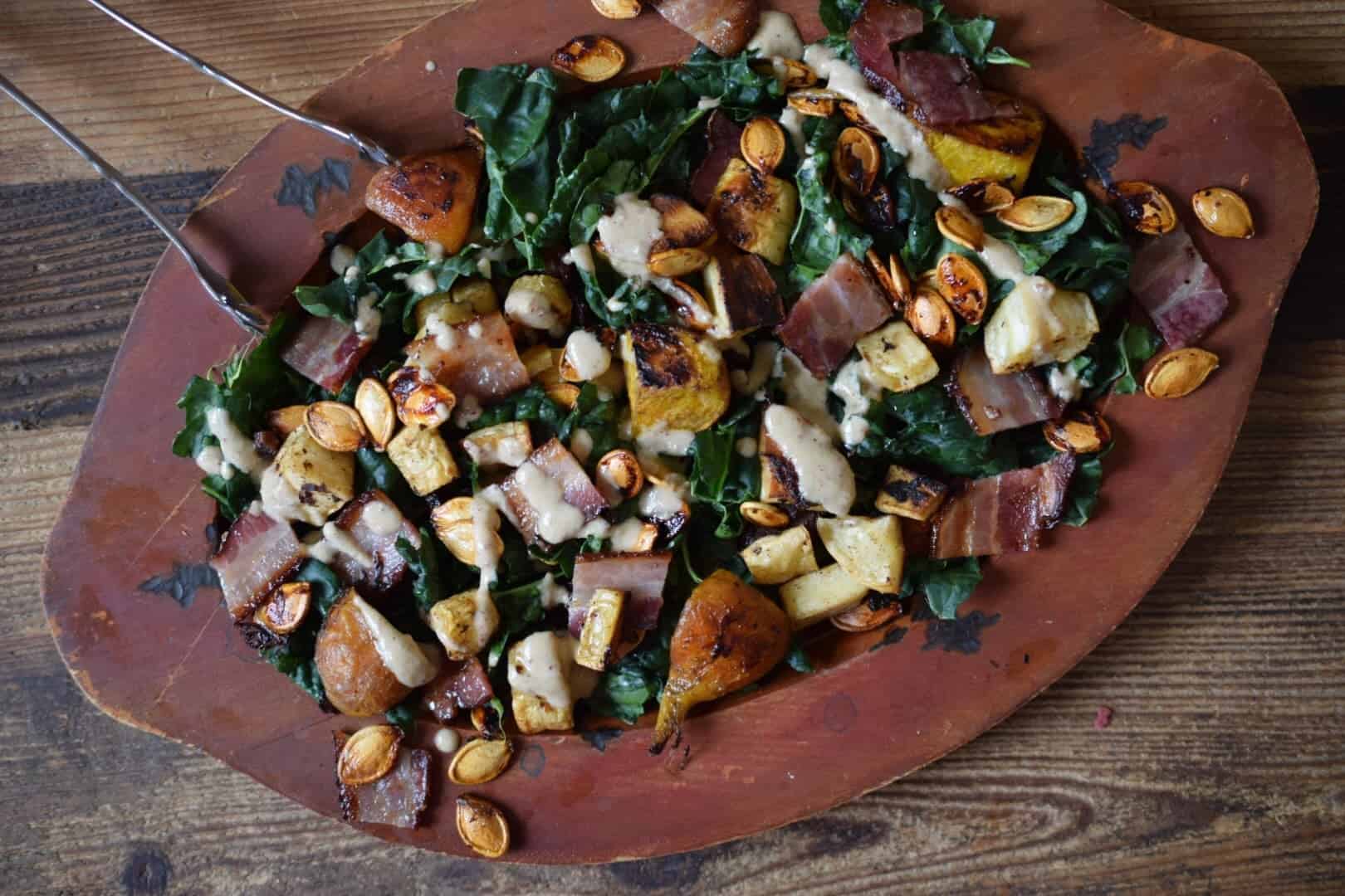 This fall salad is a celebration of seasonal produce and flavors. Roasted beets and toasty bacon, pumpkin seeds and a warm apple pecan dressing! 