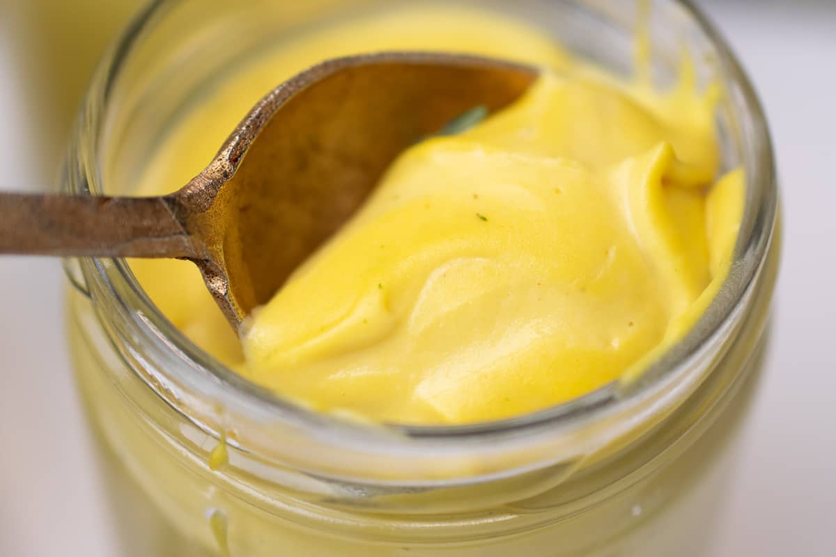 a golden spoon in jar of paleo vegan custard