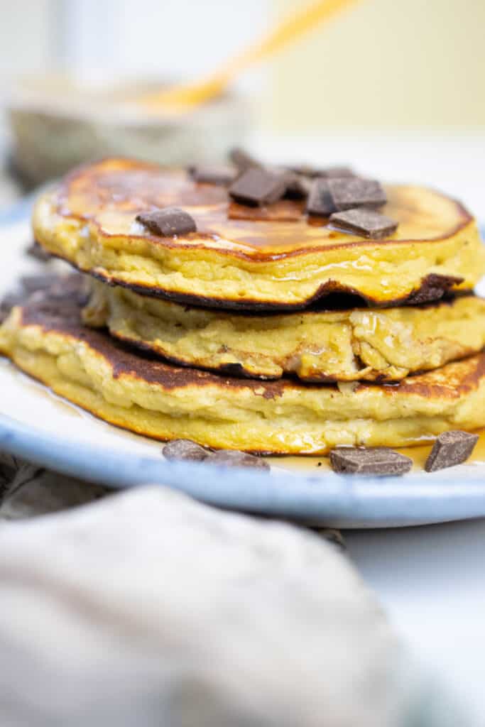 close up of 3 stacked nut free paleo pancakes with chocolate chips