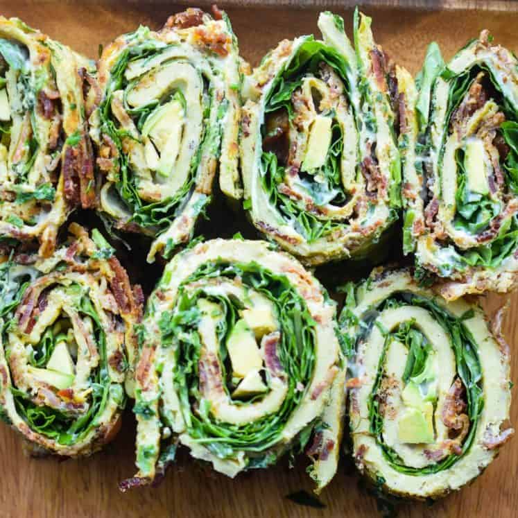 eggs rolled up with bacon and greens