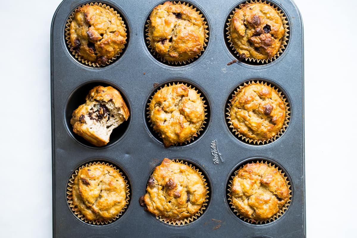 paleo banana muffins in a tin on a white counter