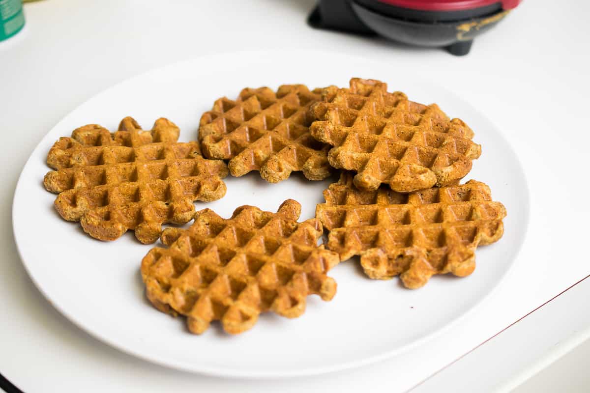 five aip waffles on a white plate
