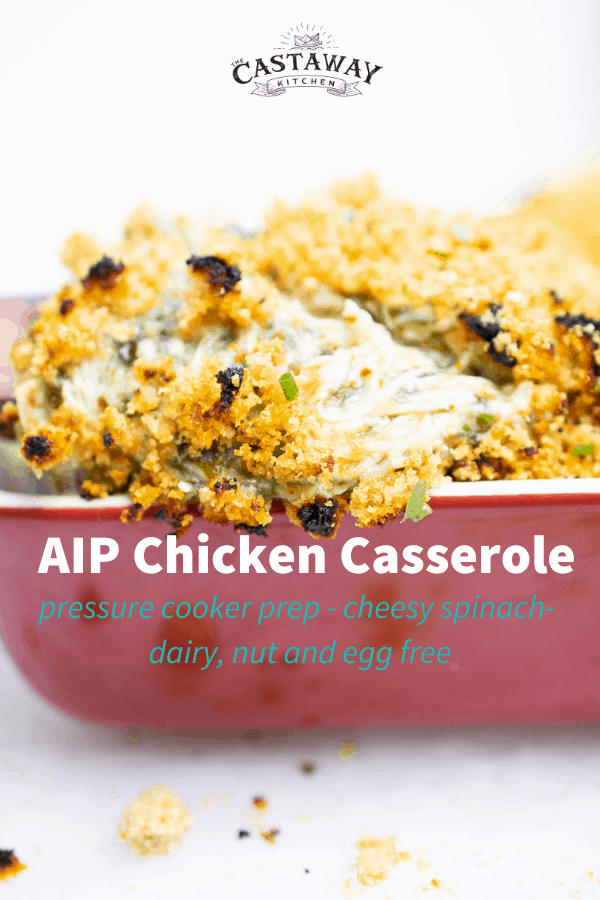 Cheesy dairy-free AIP Chicken Casserole with spinach, baked and bubbly in a red casserole dish, topped with crunchy pork panko.