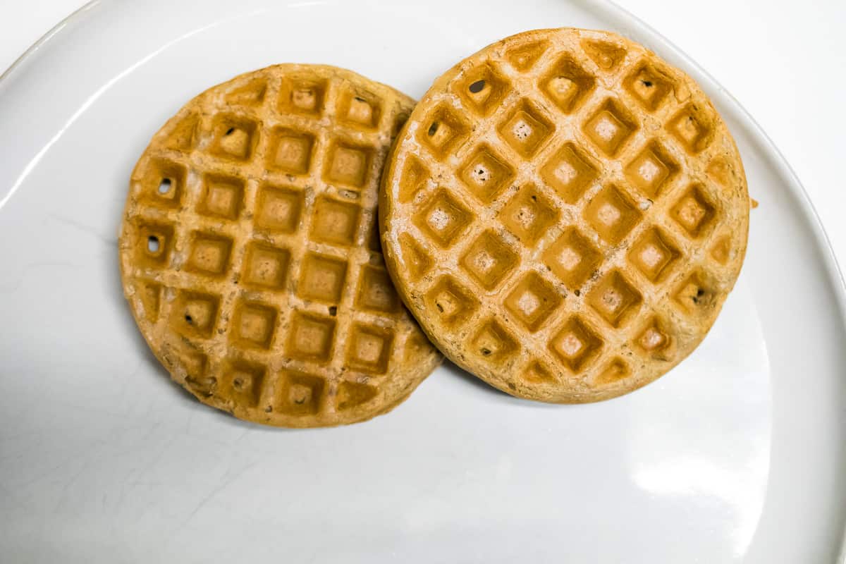 two nut free paleo waffles on a white plate