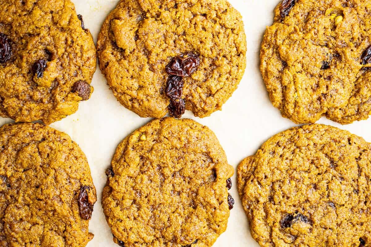 6 aip oatmeal raisin cookies on a sheet tray