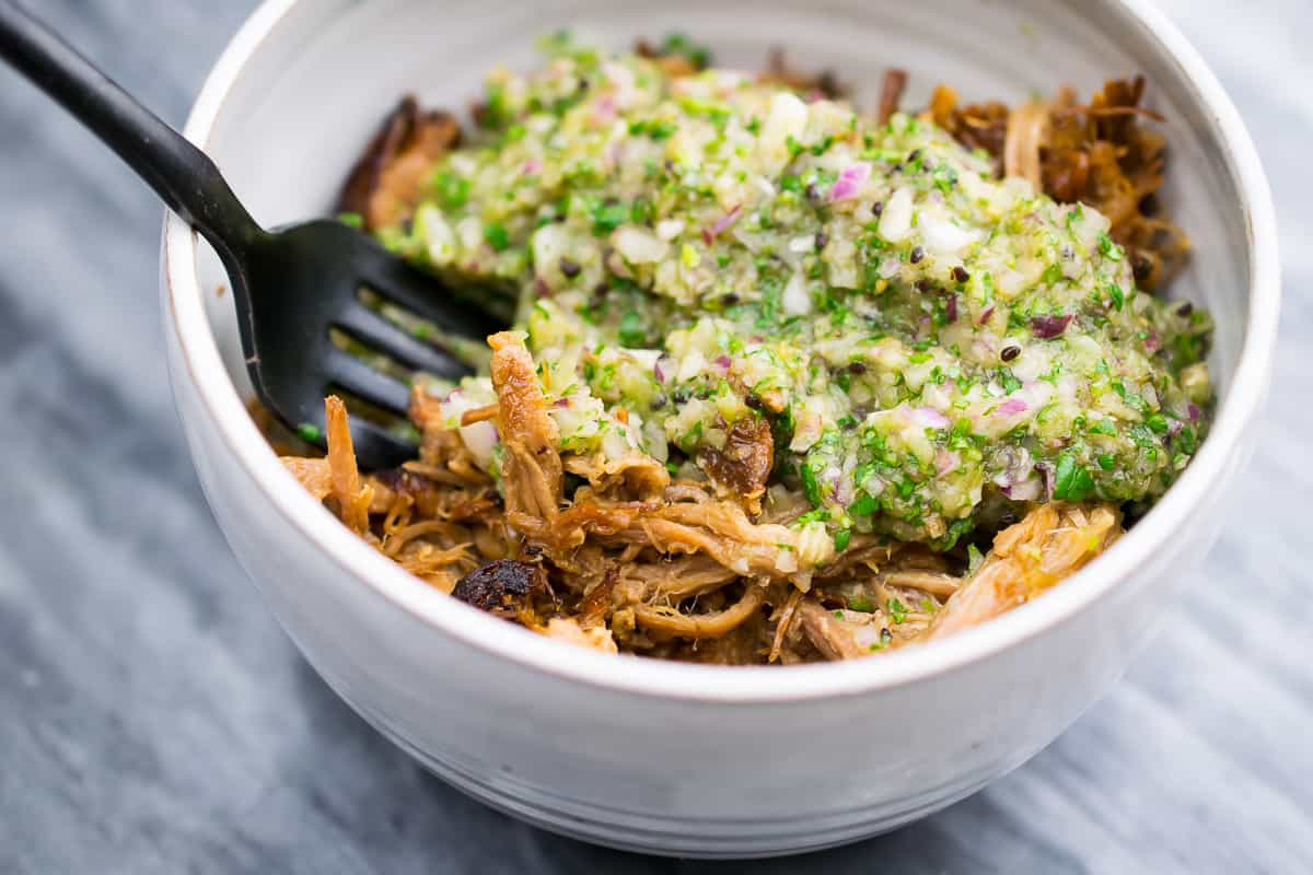 aip salsa verde served over pulled pork in a white bowl 