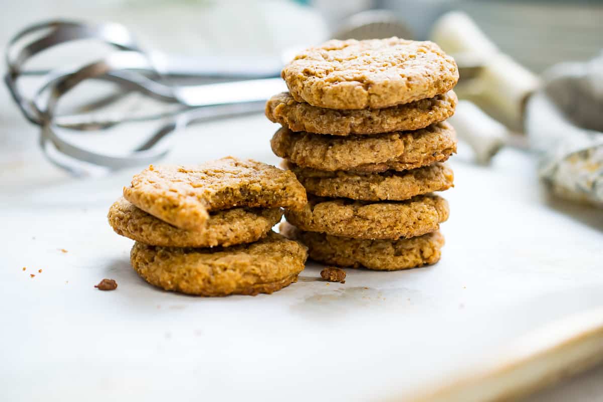 aip oatmeal cookies in two stacks- one stack with 6 cookies and a second stack with two whole cookies and a third cookie that is bitten into. 