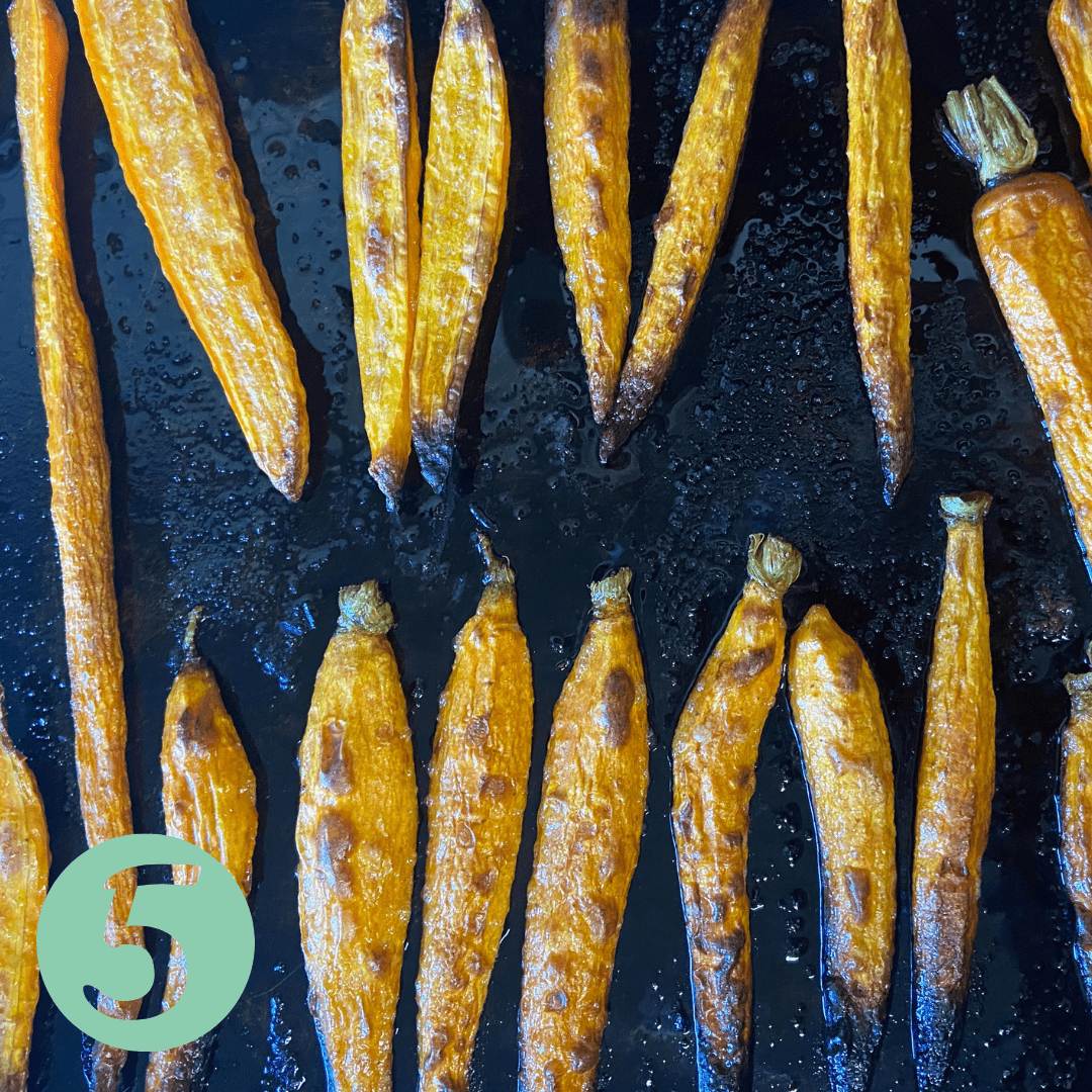 crispy roasted carrots on a sheet pan