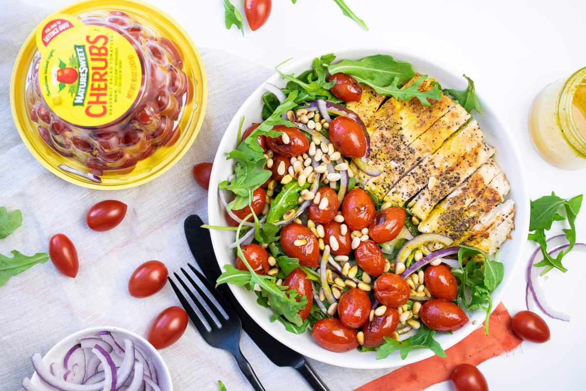 grilled chicken salad with tomatoes and pine nuts 