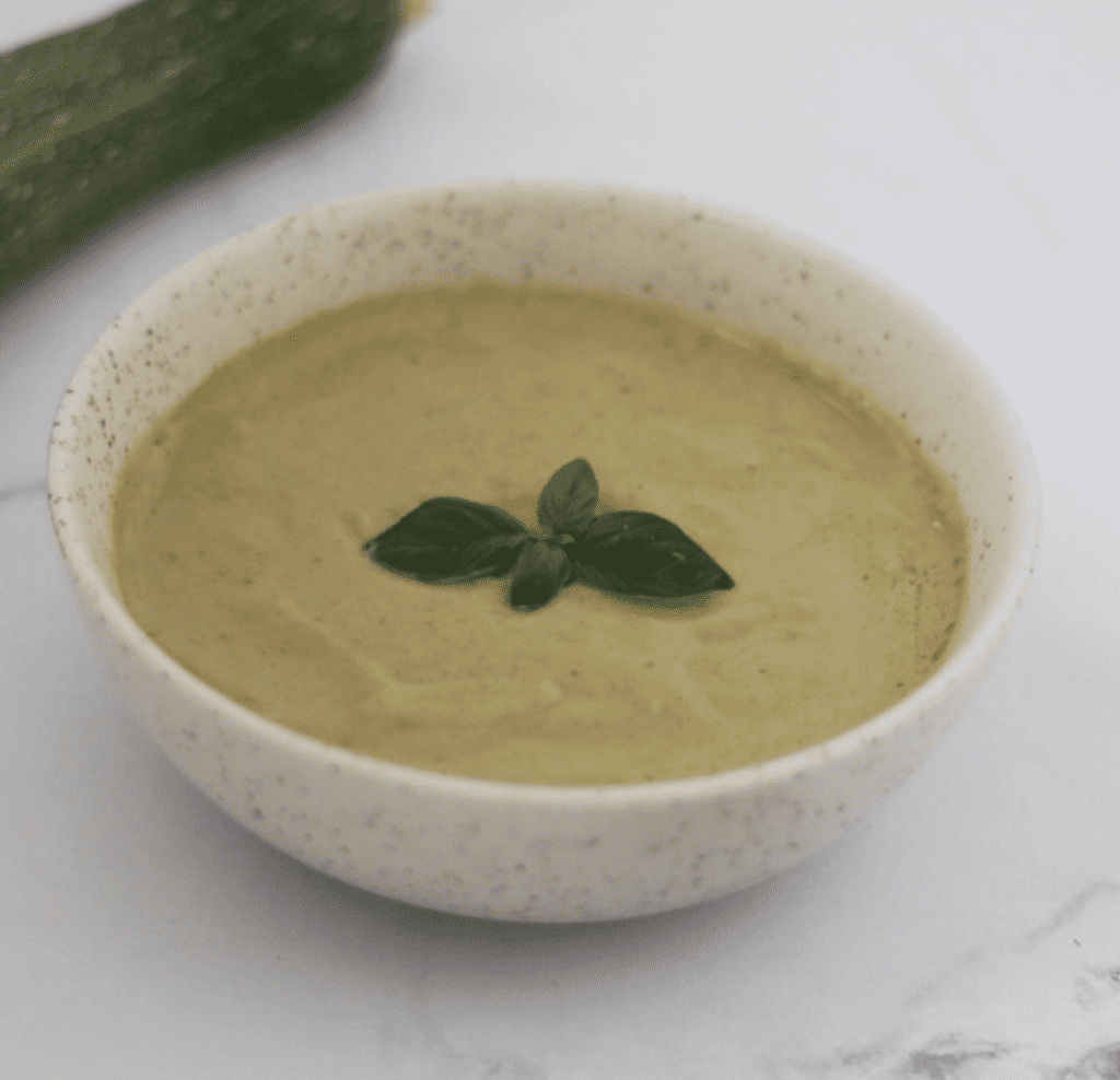 bowl with aip zucchini soup for st. patrick's day