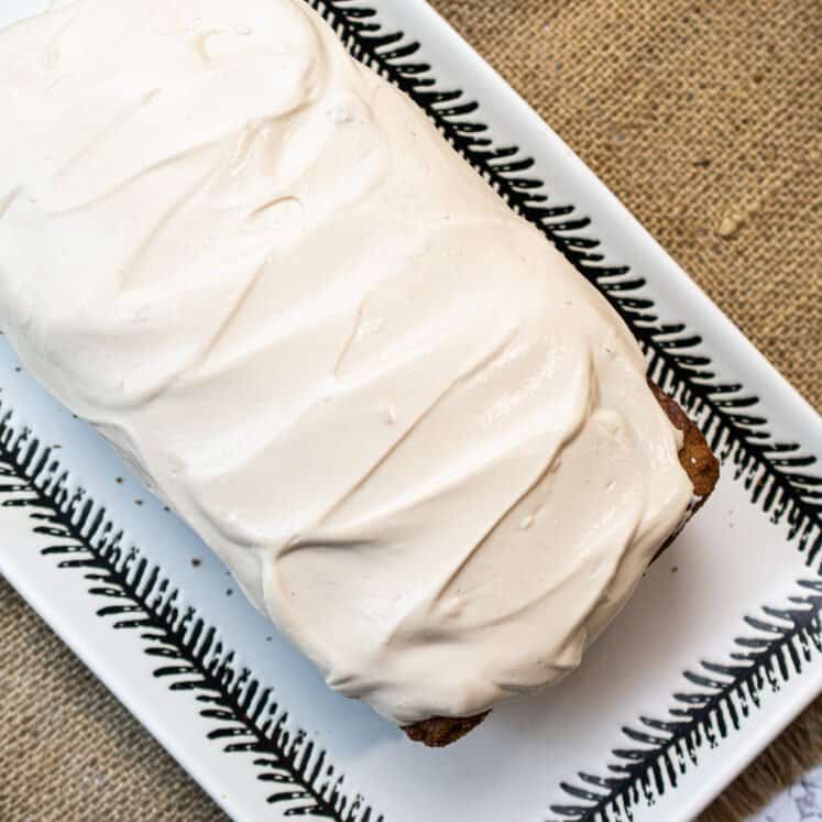 from the top a paleo carrot cake with smooth dairy free cream cheese frosting