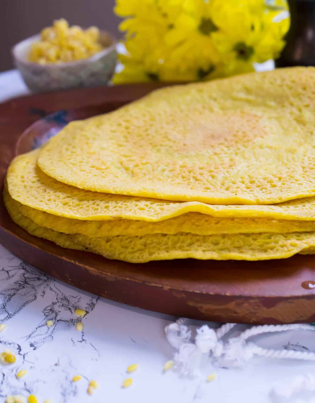 moong dal chilla lentil wrap stacked on tray