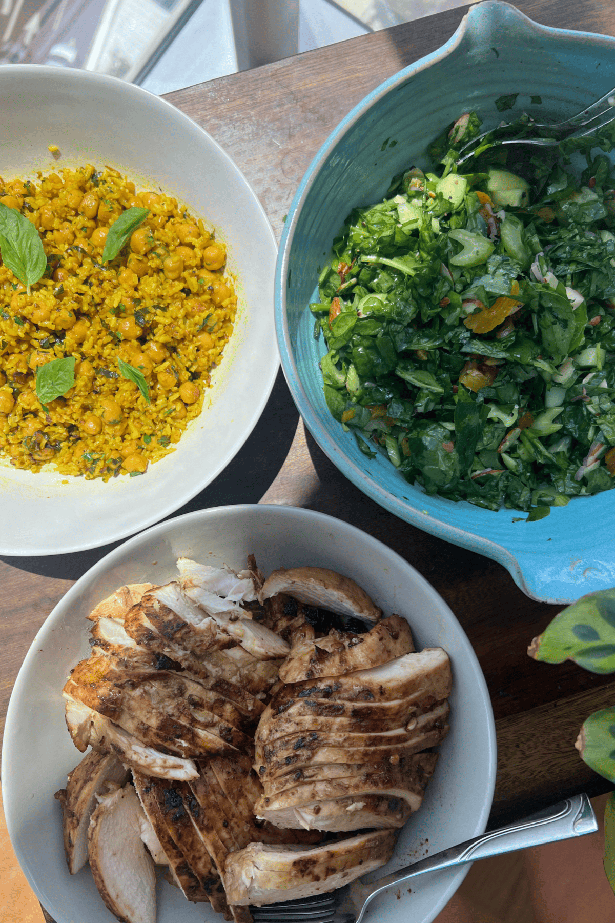 family dinner of chicken, green salad and chickpea and rice pilaf