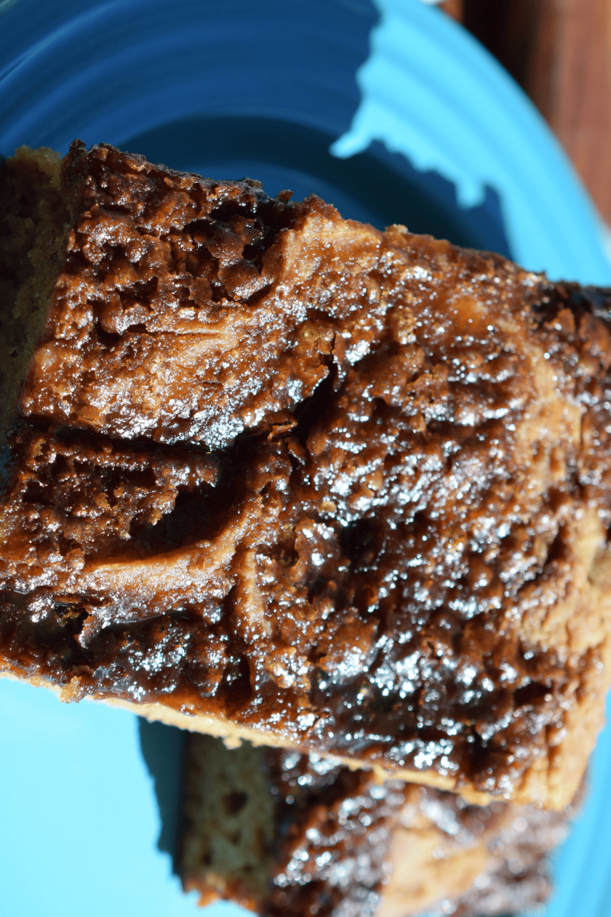 close up of the top of a gluten free coffee cake on a blue plate