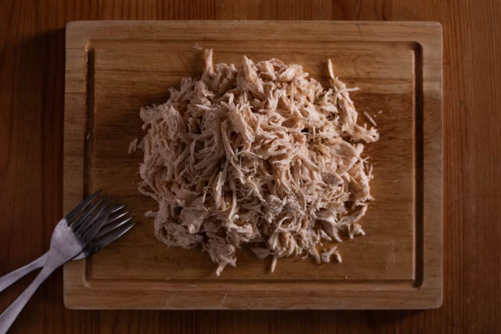 Shows an example of shredded chicken for the recipe 