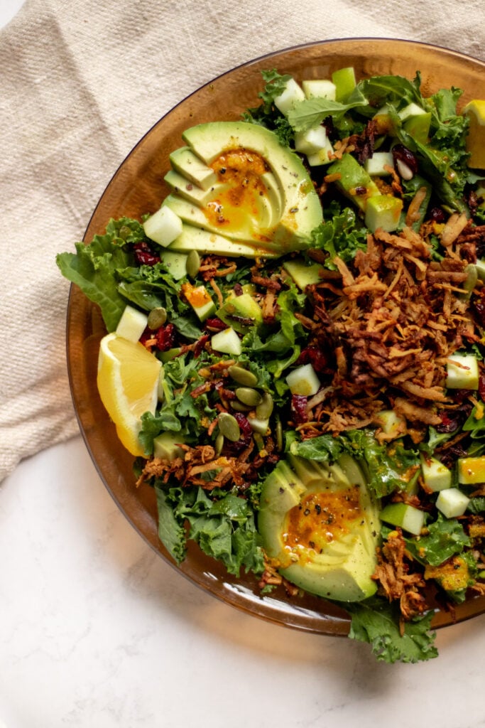 Gluten free, vegan Fall Kale Salad with Crispy Tofu in a plate