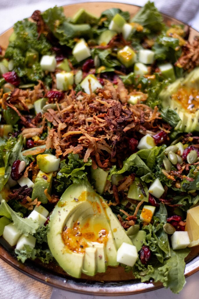 Close view of the Gluten free, vegan 
Fall kale salad with crispy tofu