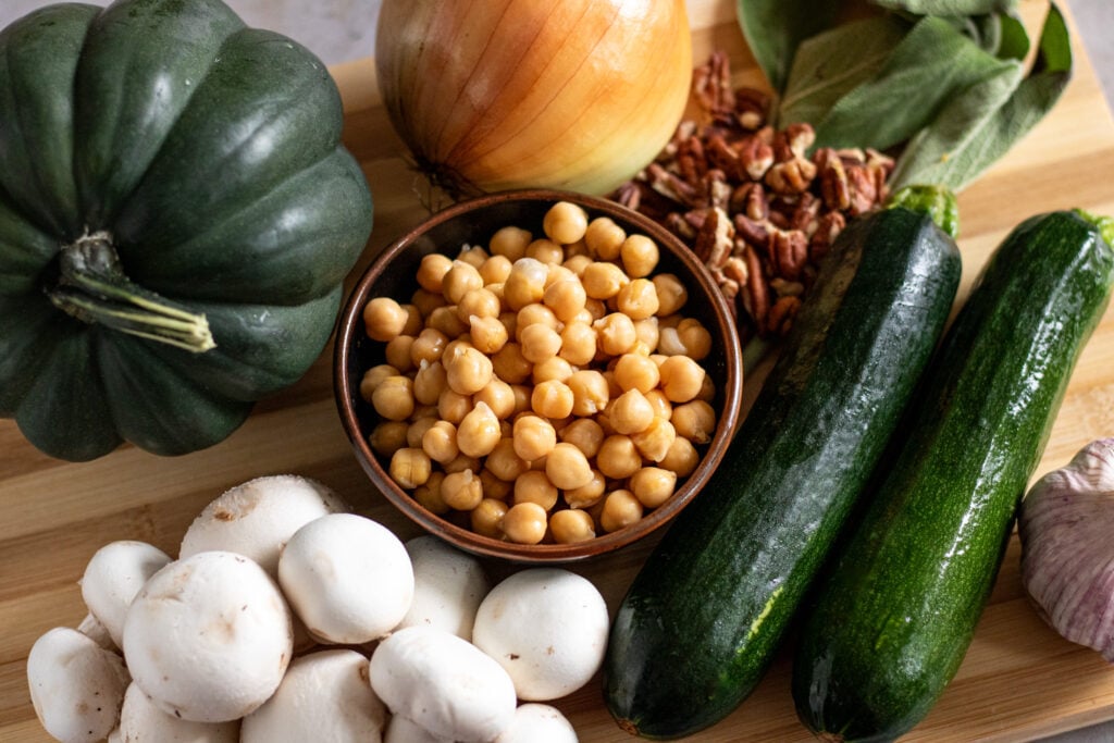 Gluten-free Zucchini and Mushroom Stuffed Squash with Pecan and Chickpea Crumble